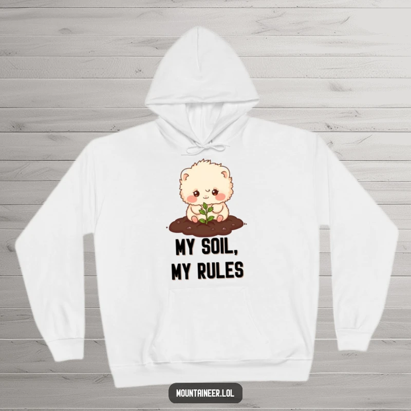 Funny hoodie displaying a small, fluffy creature with a wide smile, planting a tiny seed in the earth, perfect for cozy, humorous wear.