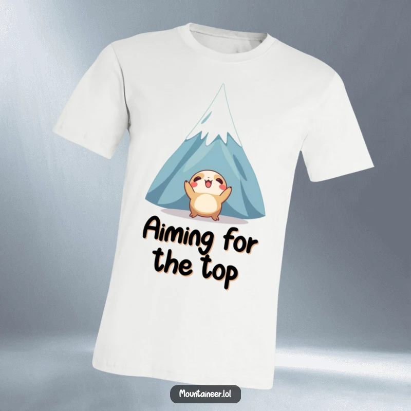 Funny t-shirt featuring a creature gazing upwards with excitement at a towering, snow-capped mountain, symbolizing ambition and exploration.